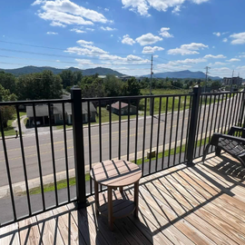 Your private balcony invites you to unwind with mountain views, fresh air, and comfortable seating—perfect for morning coffee or evening relaxation.