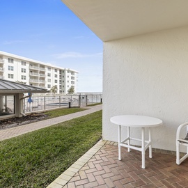 Patio with clubhouse and pool views