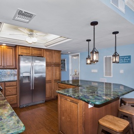 Lovley kitchen with island and barstools.