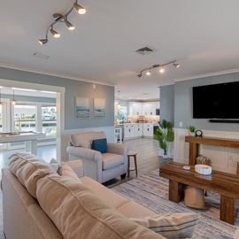 A stylish modern living room with warm wood accents.