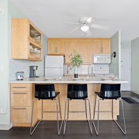 Kitchen Island with 3 barstools.