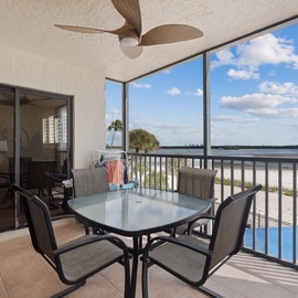 Screened in patio with a view of the beach!