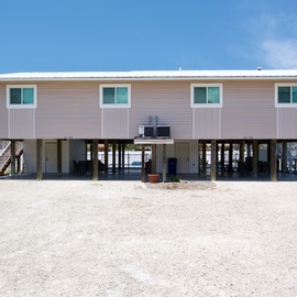 Duplex with divided underneath hangouts.