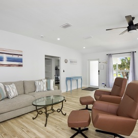 Entrance leading to living room with recliner chair