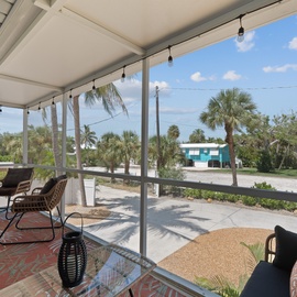 Unit 2's covered and screened in patio.