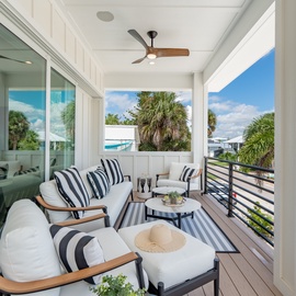 Cozy balcony seating with views from the 2nd floor.