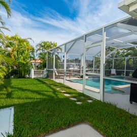 Dock area located behind pool.