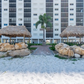 Tiki Hut seating next to walkway to beach