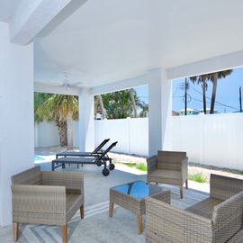 Shaded seating area by pool