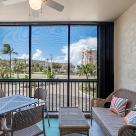 Take a seat on the balcony with views of the beach.