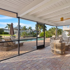 Covered and screened in outdoor patio.