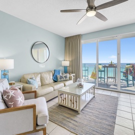 Relax in your coastal living room with stunning sea views from your private balcony and comfortable seating.