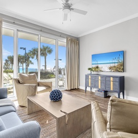 Welcome to Tides at Tops'l 103 - Sunny Tide Up! Unwind in your bright living space with panoramic beach views and coastal decor creating the perfect seaside retreat.