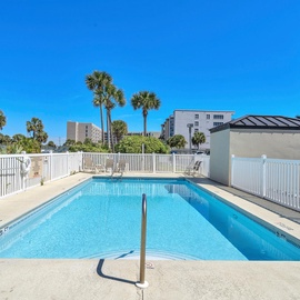 Dive into crystal-clear waters surrounded by swaying palms and endless blue skies - your perfect poolside retreat awaits at Emerald Towers West 3007.