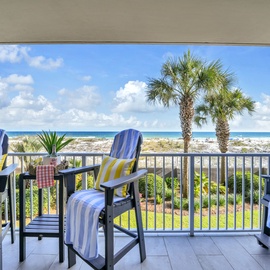 Relax in your private balcony chairs and soak in stunning beachfront views framed by swaying palms and endless blue skies.