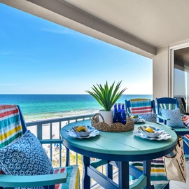 Savor morning coffee on your private balcony while azure waters stretch endlessly before you, creating the perfect beachfront escape.