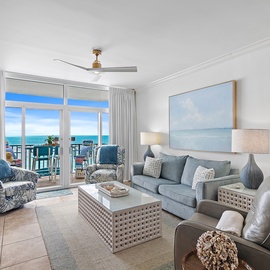 Relax in your coastal sanctuary where ocean blues meet comfortable seating and stunning sea views stretch endlessly beyond your private balcony.