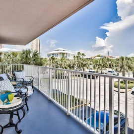 Relax on your private balcony with tropical palm views and comfortable seating for morning coffee or evening unwinding.