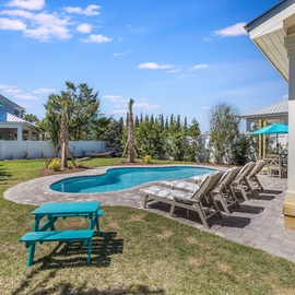 This backyard offers plenty of cozy seating options.