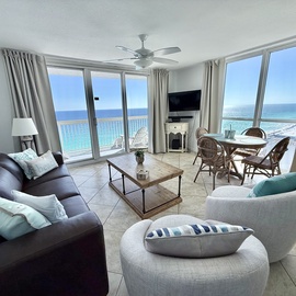 Relax in your bright living space with stunning ocean views just steps from your private balcony and beach access.