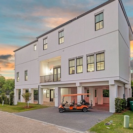 This home is surrounded by vibrant, tropical serenity.