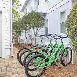Bright green bikes await your coastal adventures, explore the community and the nearby tourist attractions.