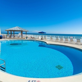 Dive into crystal-clear waters with beautiful ocean views spanning endlessly before you. Your perfect poolside paradise awaits.