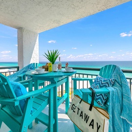 Sip your morning coffee at this turquoise dining set while watching the endless gulf stretch before you.