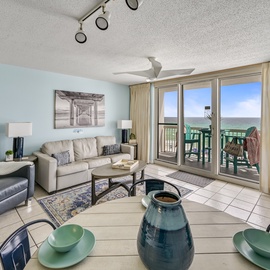 Relax in your comfortable living room with stunning Gulf views through expansive glass doors leading to your private balcony.