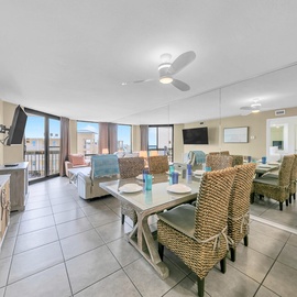 Your spacious living area features comfortable seating and dining for six, with stunning city views from your private balcony.