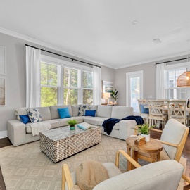 Relax in your bright living space with plush seating and coastal touches, perfect for unwinding after exploring.