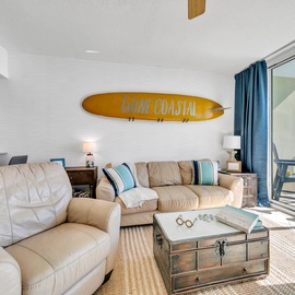 Sink into plush leather seating as ocean breezes drift through your sliding doors, creating the perfect coastal retreat for relaxation.