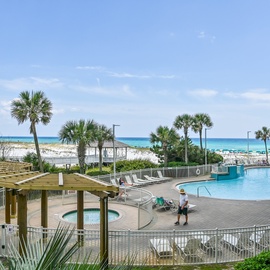 Beachfront Pelican Beach Resort with pristine white sand, turquoise waters, and tropical palms creating the perfect coastal getaway backdrop.