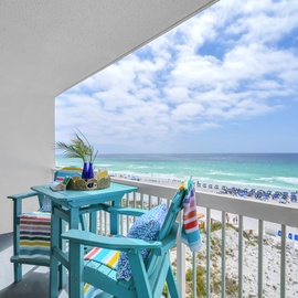 Your private balcony features colorful seating where you can sip morning coffee while watching waves roll onto pristine white sand.