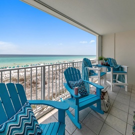 Relax in your colorful beach chairs on this spacious balcony with stunning direct gulf views and soft white sand below.