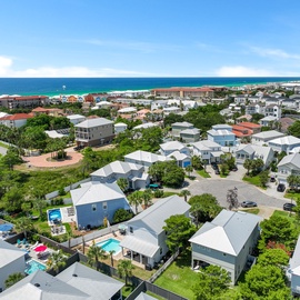 Aerial view of the property and emerald waters of the coast.