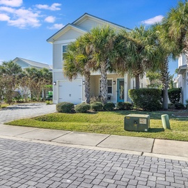 Beautiful landscaping makes this home feel like a tropical retreat.