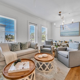 Sink into plush seating while enjoying ocean breezes through bright windows in your stylishly appointed living space.