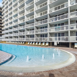 Dive into your own tropical oasis with this sparkling pool featuring playful fountains and plenty of loungers for sunny afternoons.