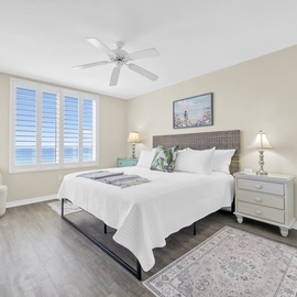 Rest peacefully in your coastal master bedroom with ocean breezes through plantation shutters and cool comfort from the ceiling fan.