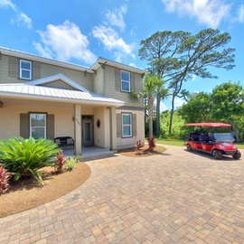 Front of home has room for 4 vehicles plus golf cart