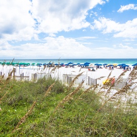 Beautiful beachfront location with pristine white sand and turquoise waters just steps from the property.