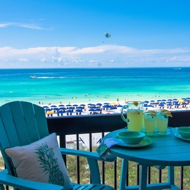 Sip your morning drink on this stunning beachfront balcony with endless turquoise waters and pristine white sand stretched before you.