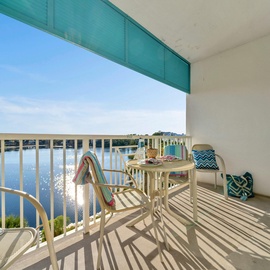 Your private waterfront balcony offers stunning lake views with comfortable seating for morning coffee or sunset drinks.