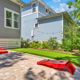 Challenge friends to cornhole games on your private putting green and patio - where vacation fun meets backyard luxury.