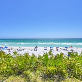 Stunning beachfront location with pristine white sand and crystal-clear waters just steps away from the property.