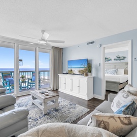 Relax in your spacious oceanfront living room with stunning sea views, comfortable seating, and a peaceful coastal ambiance.