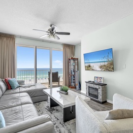 Unwind in your oceanfront living room with stunning sea views and beach-themed decor creating the perfect coastal getaway.
