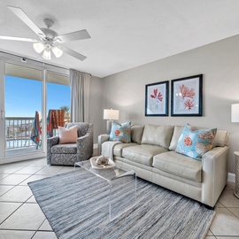 Your coastal living room opens to Gulf views with plush seating, perfect for relaxing after beach days.