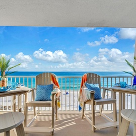 Step onto your private balcony where turquoise waters stretch endlessly before you, with tropical breezes and beach-inspired decor creating the perfect oceanfront escape.